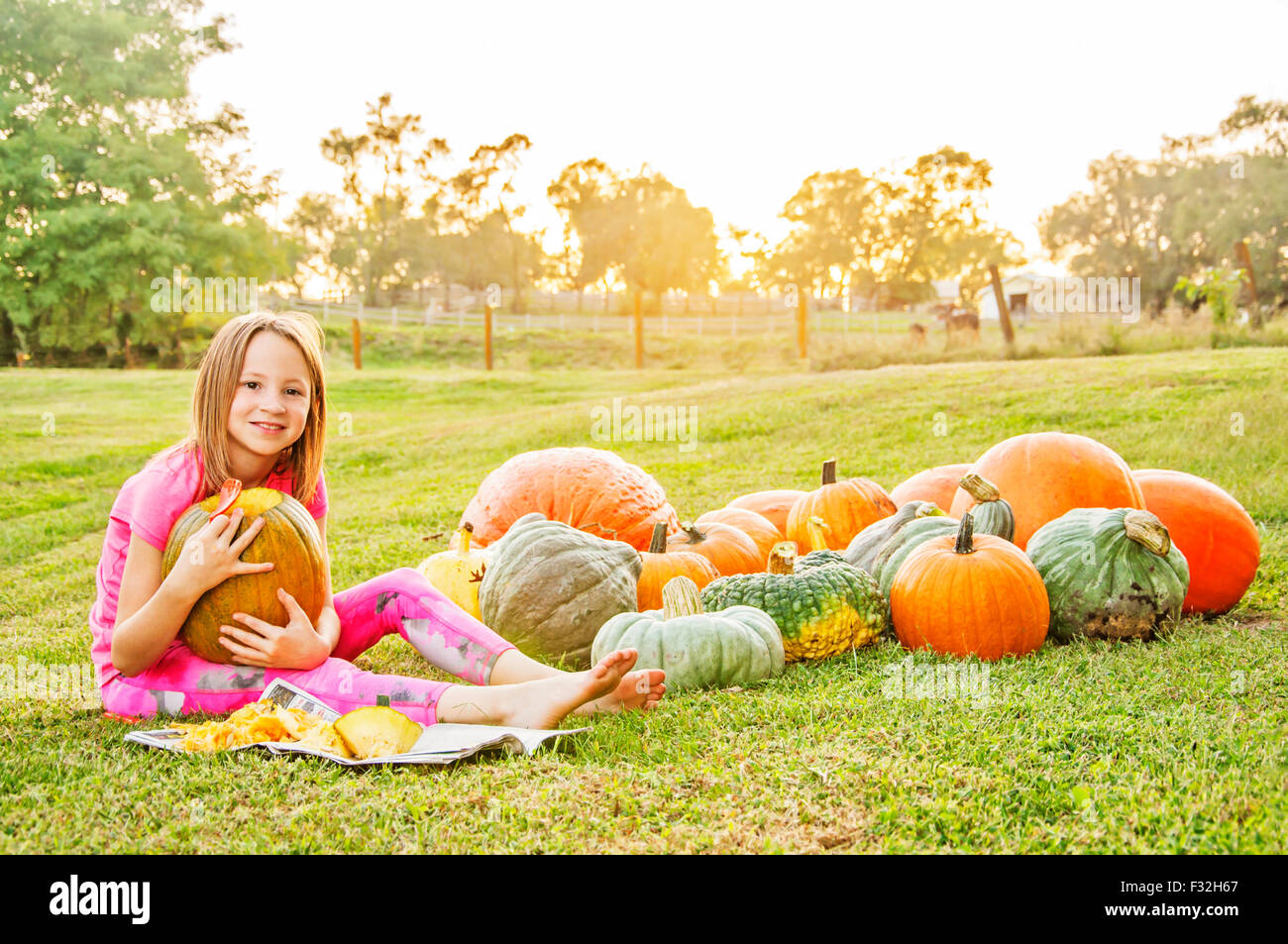Girl by pumpkins and squash Stock Photo