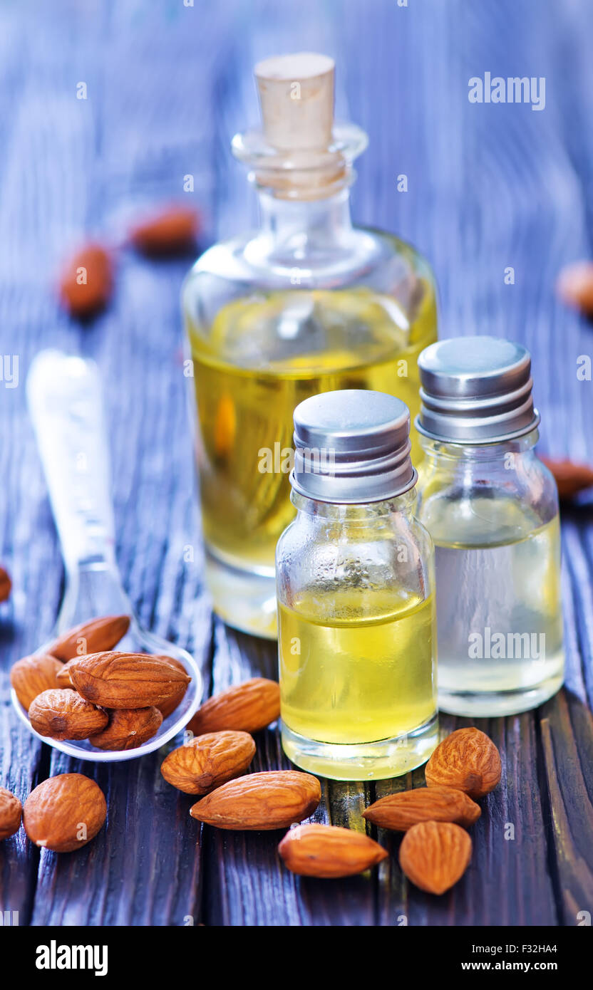 almond oil in bottle and on a table Stock Photo Alamy