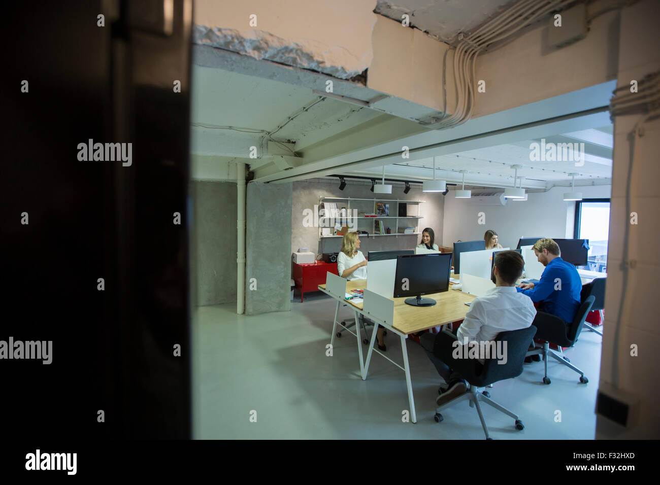 Young people in the office Stock Photo - Alamy