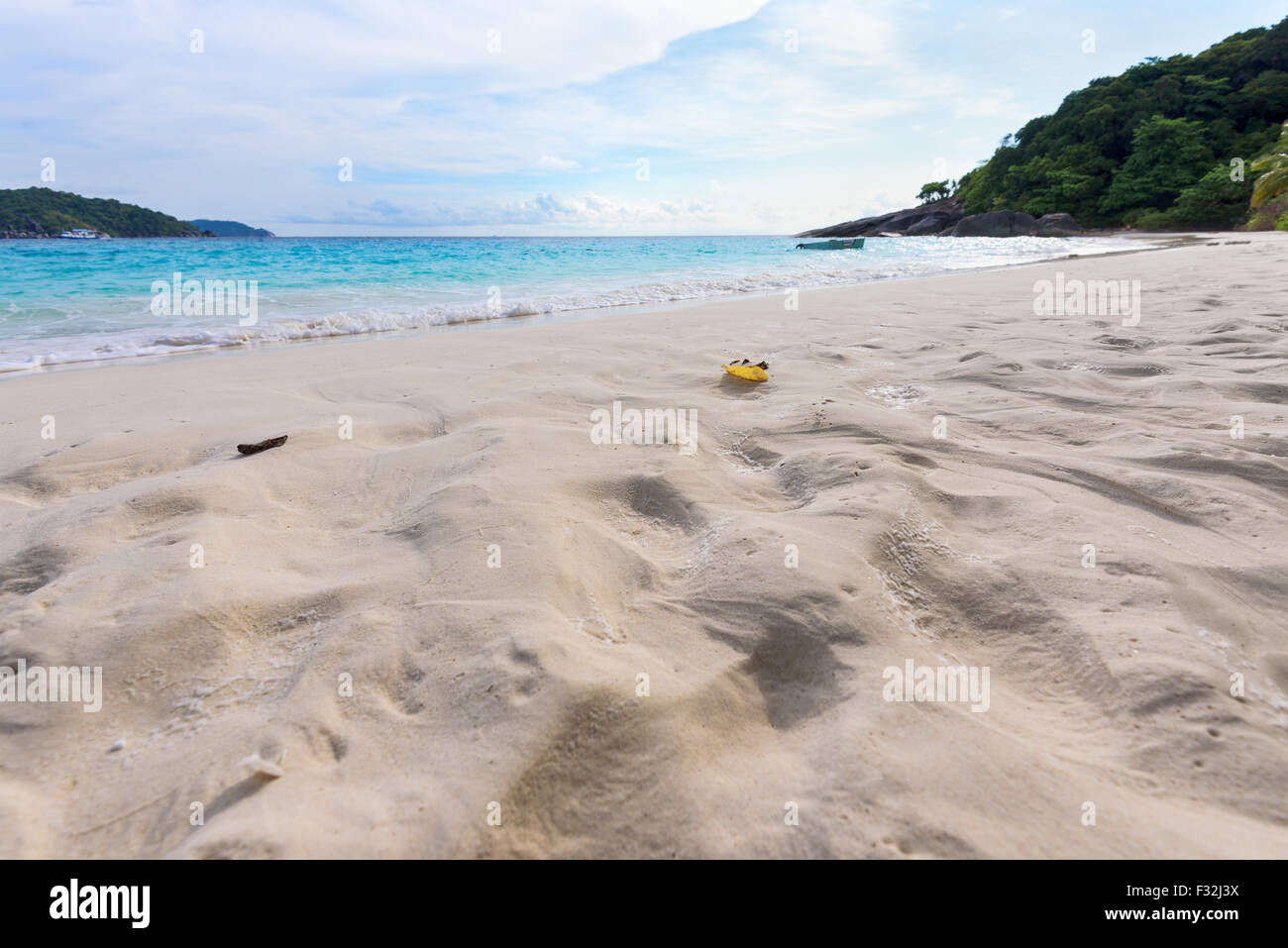 Visitors footprints on sand at beach near the sea during morning high tide remove traces of the chaos return to peaceful in Koh Stock Photo