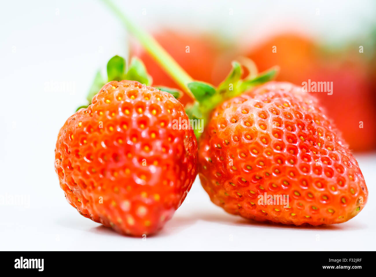 Strawberry berries on a white background Stock Photo - Alamy