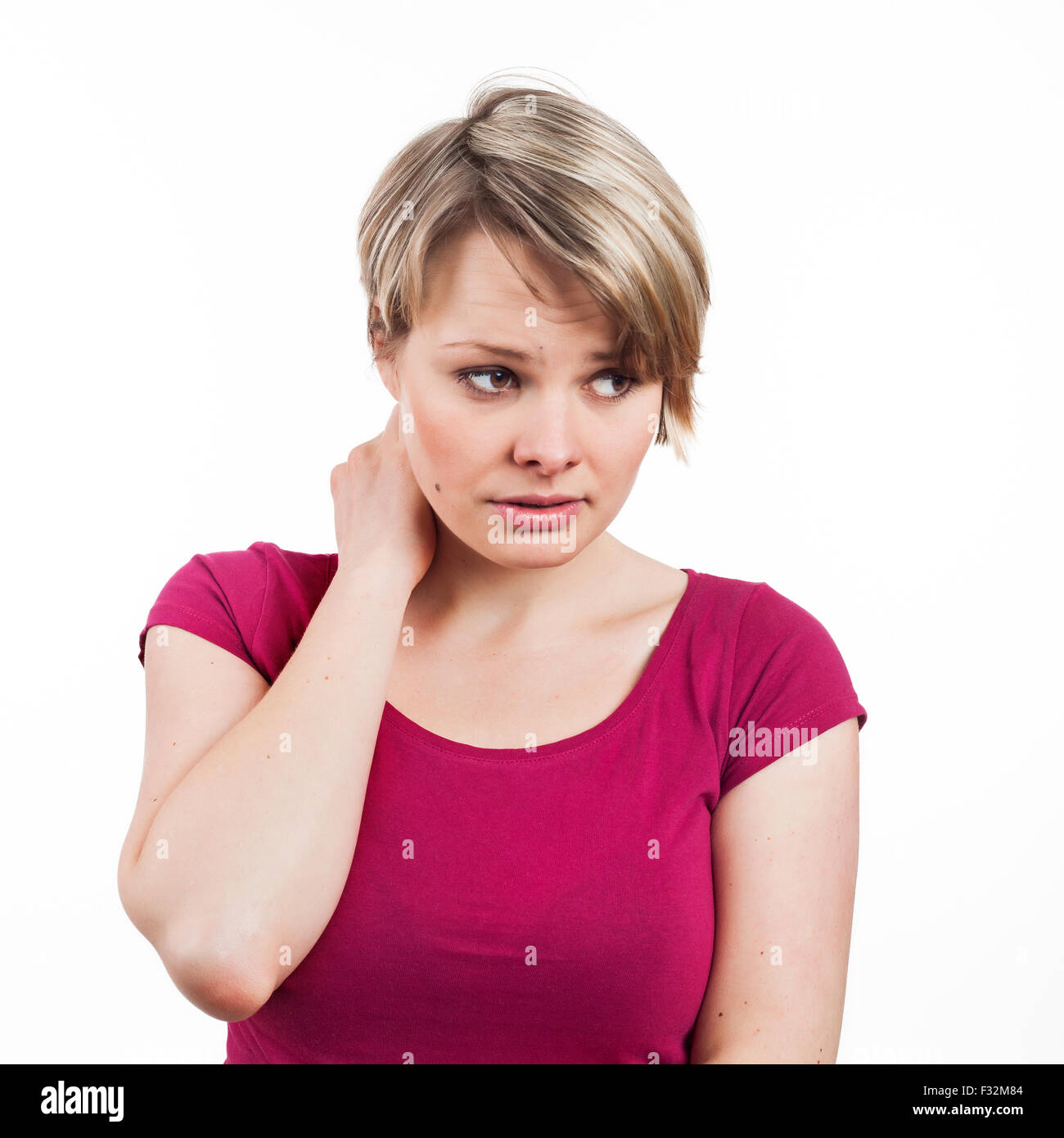 Portrait of a female looking worried, disturbed, isolated on white Stock Photo