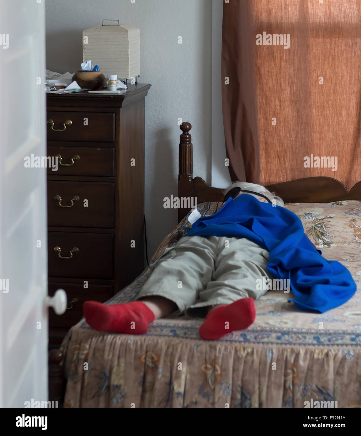 Elderly woman taking a nap in the afternoon. Stock Photo