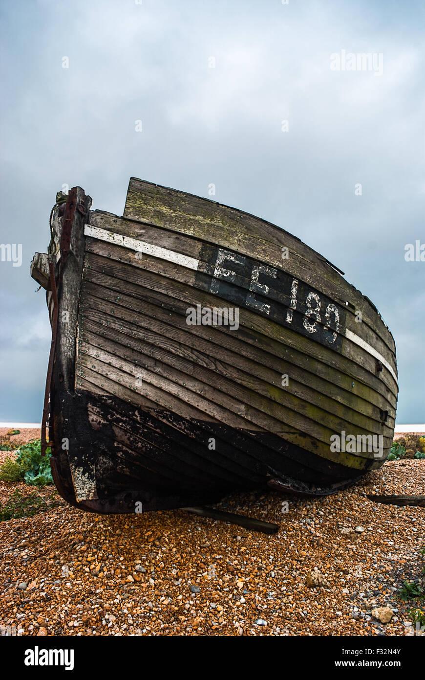 Abandoned fishing boat left to rot and decay on the beach at Dungeness ...