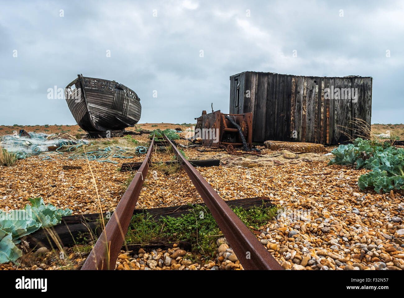Abandoned fishing boat left to rot and decay on the beach at Dungeness ...