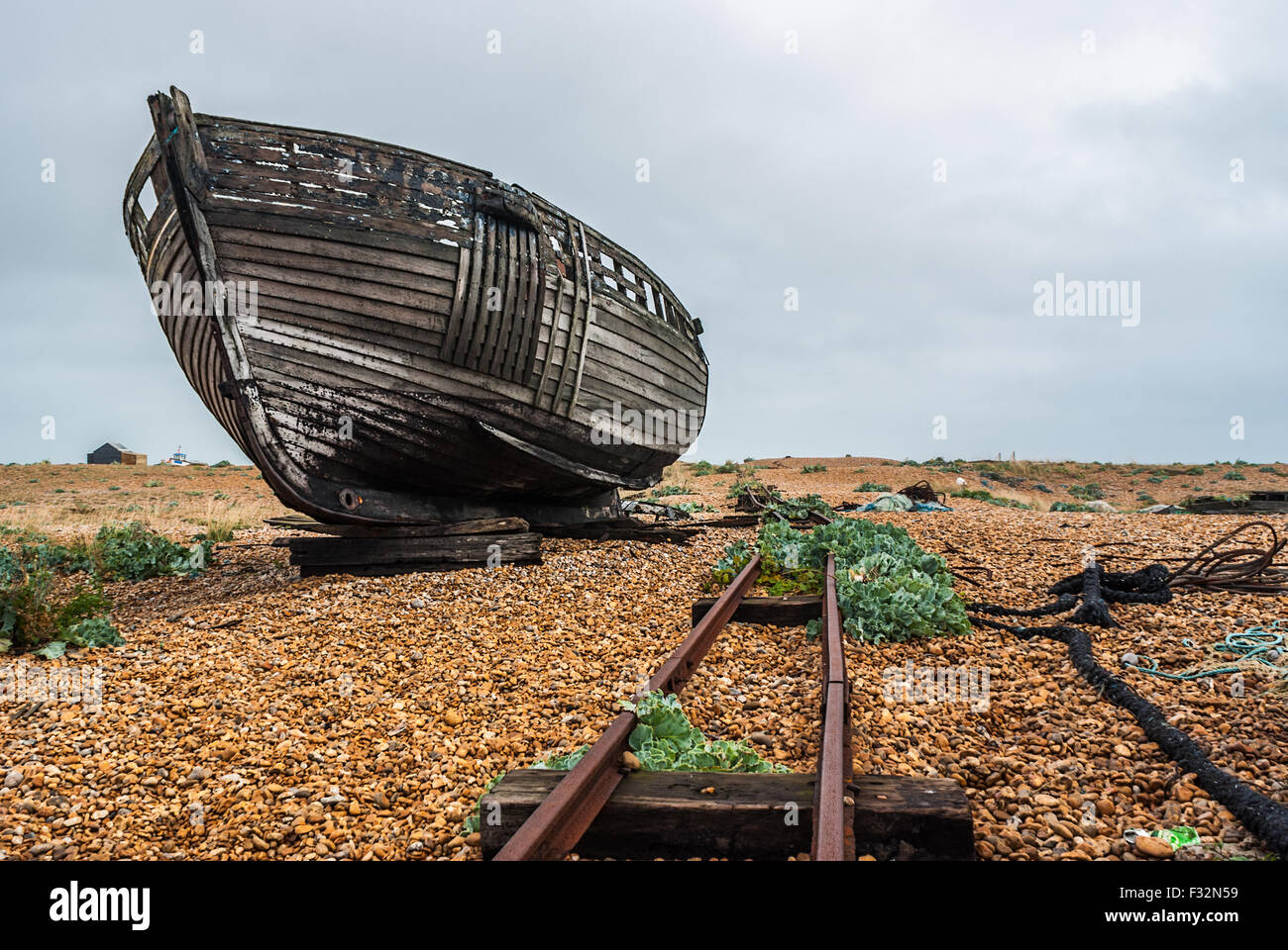 Abandoned fishing boat left to rot and decay on the beach at Dungeness ...