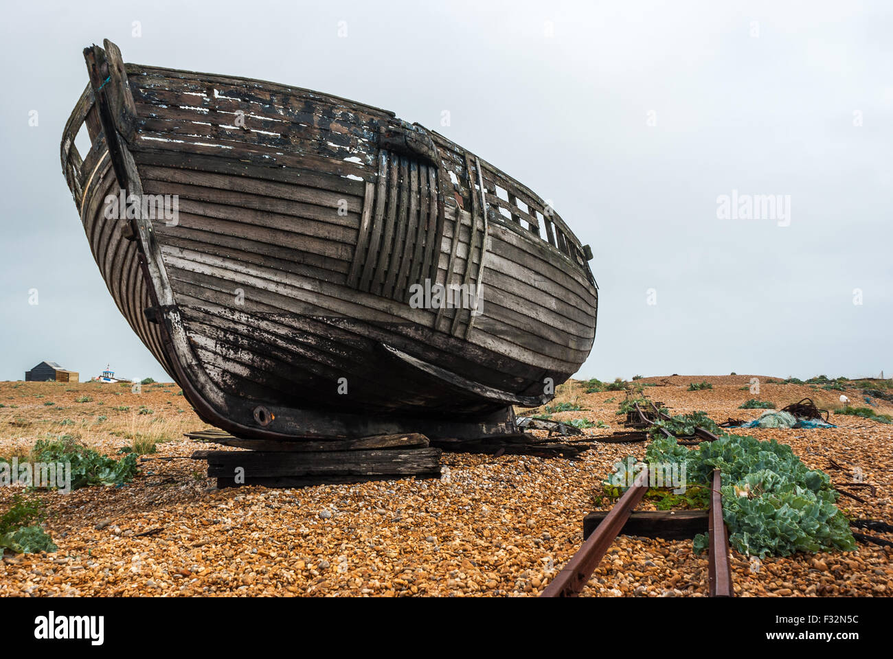 Abandoned fishing boat left to rot and decay on the beach at Dungeness ...