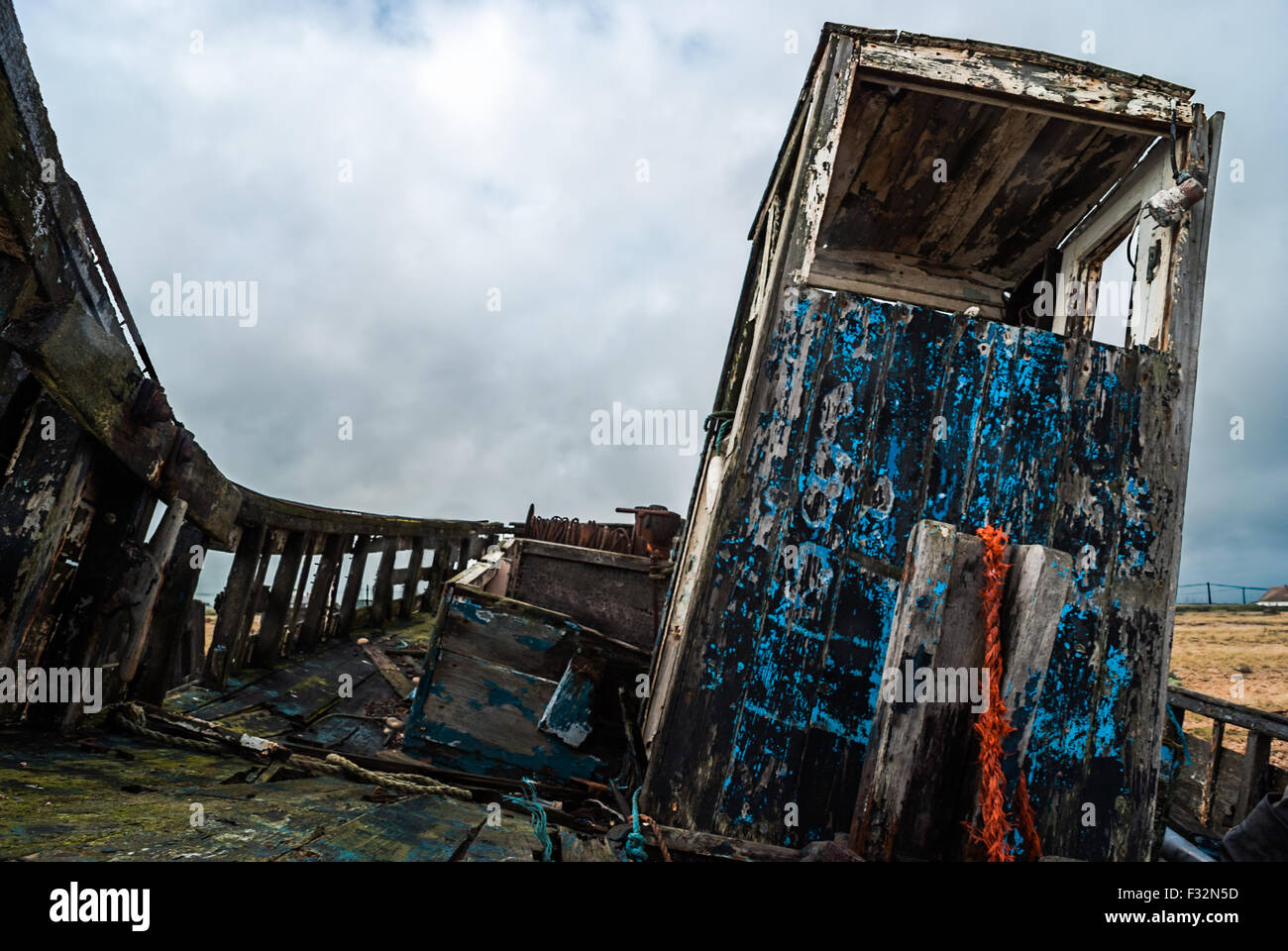 Abandoned fishing boat left to rot and decay on the beach at Dungeness ...