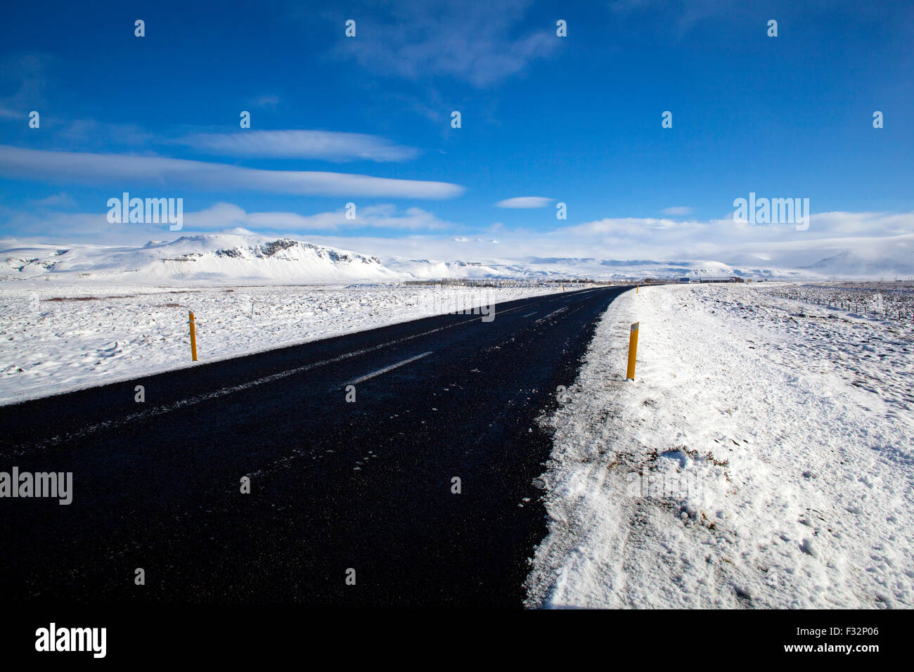 Wet road with impressive landscape in winter Stock Photo