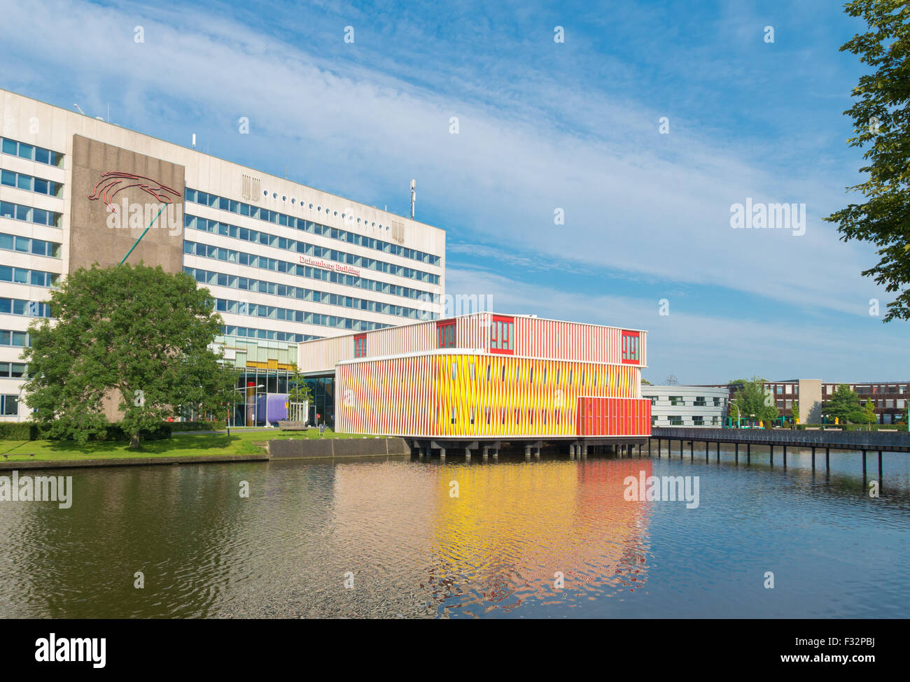 GRONINGEN, NETHERLANDS - AUGUST 22, 2015: Modern orange building on the groningen university campus. The university counts aroun Stock Photo