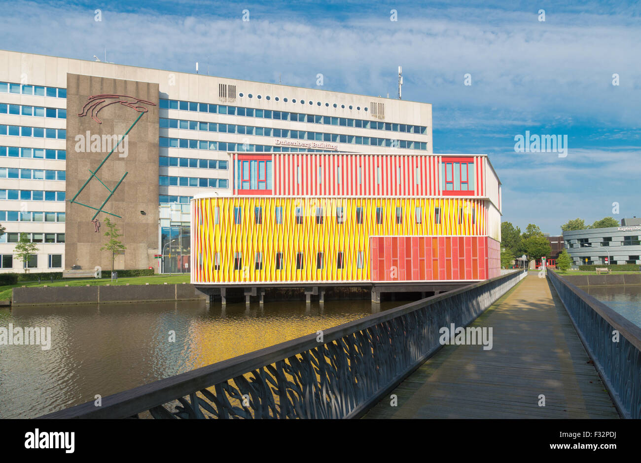 GRONINGEN, NETHERLANDS - AUGUST 22, 2015: Modern orange building on the groningen university campus. The university counts aroun Stock Photo