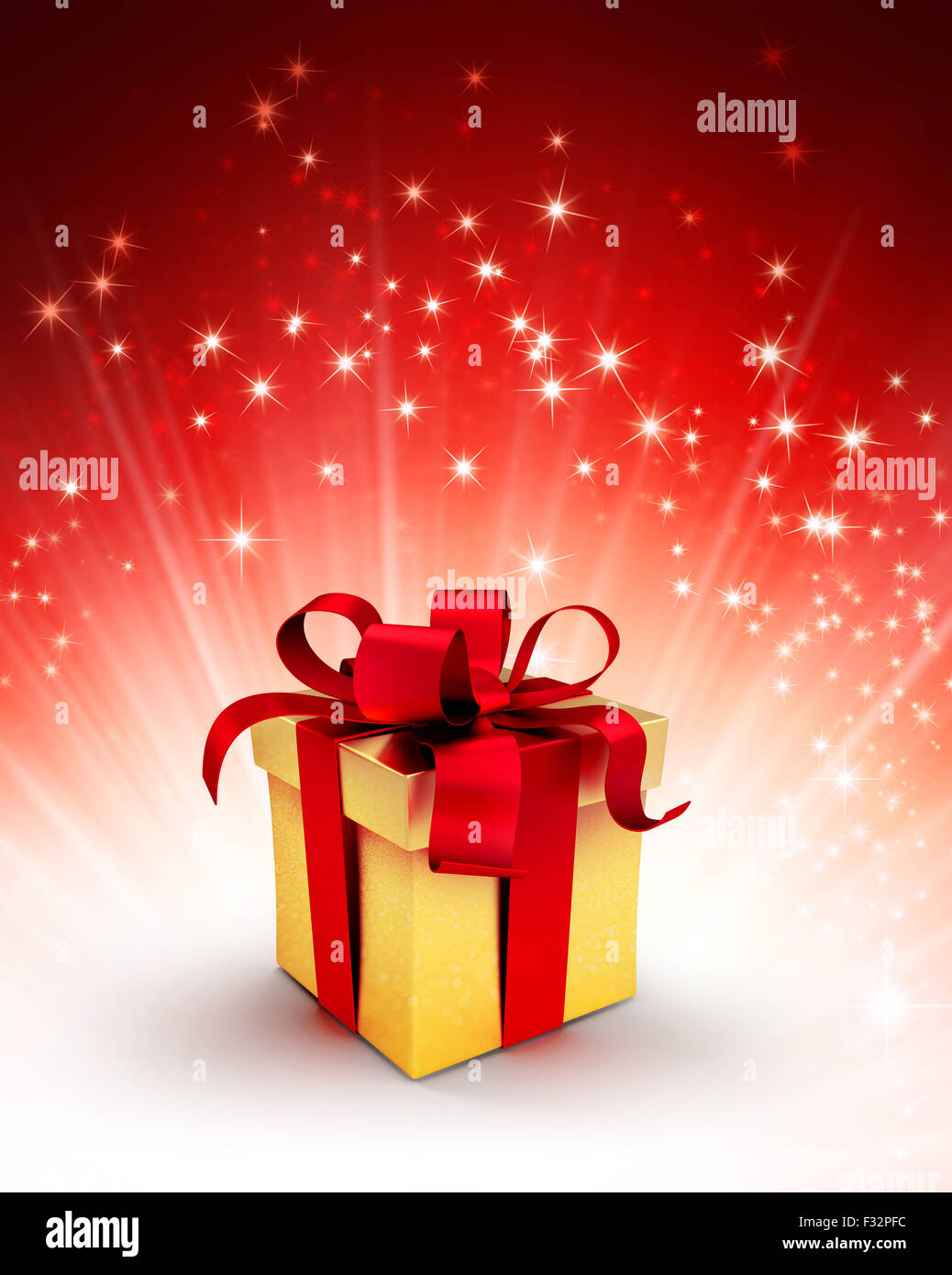 Golden gift box with red ribbon on a shiny red background with