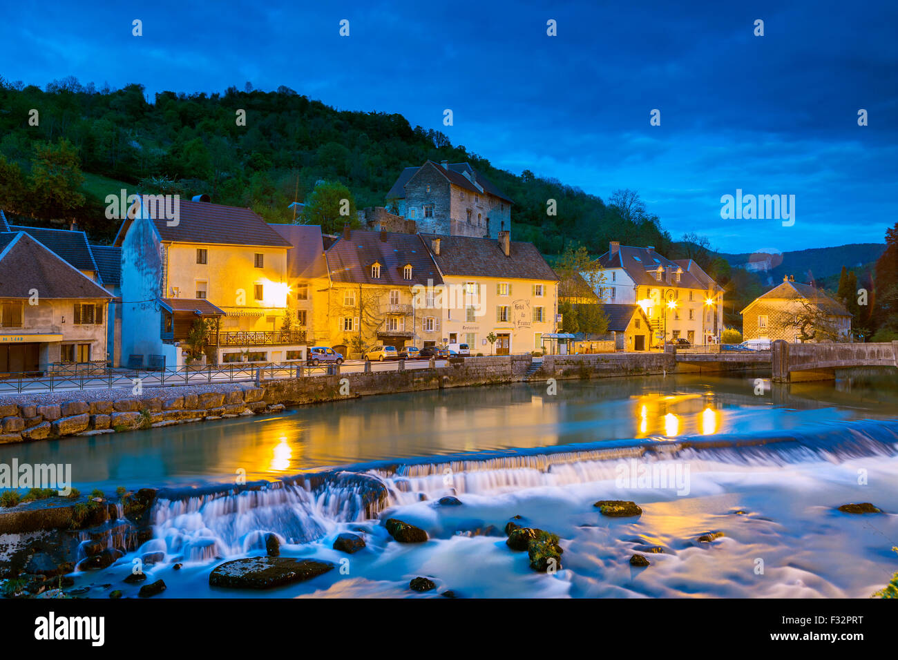 River Loue flowing through picturesque village Lods, Loue Valley, Doubs, Franche-Comte, France, Europe. Stock Photo