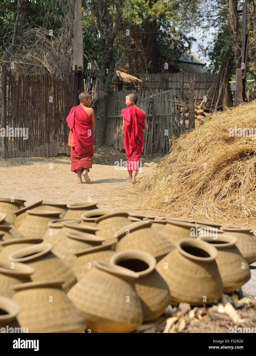 Two young monks walking through Yandabo village on the banks of the Irrawaddy River (Ayeyarwady River) Myanmar (Burma,Birma) Stock Photo