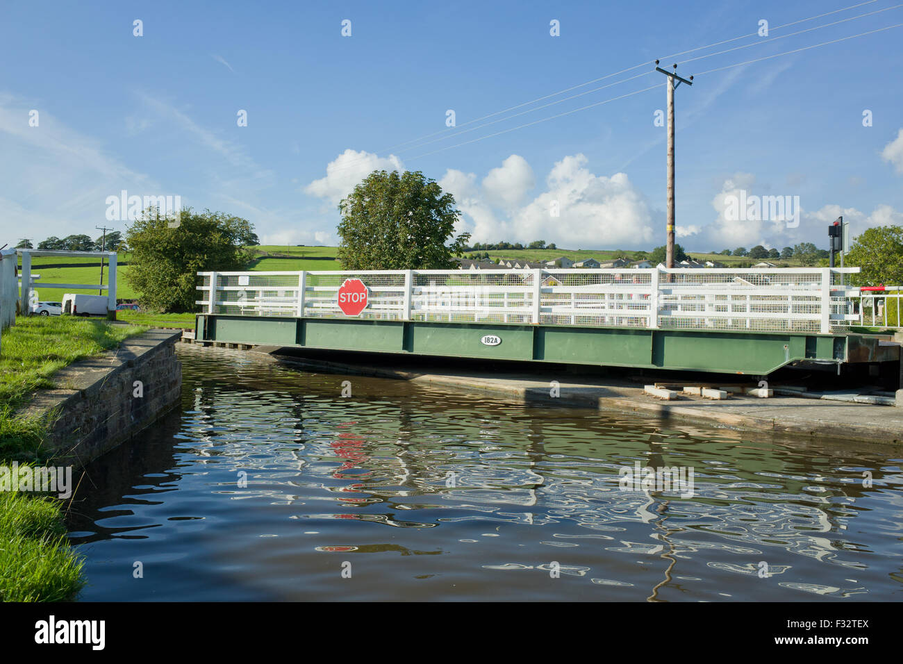 Swing bridge opening over the Leeds Liverpool canal. Stock Photo