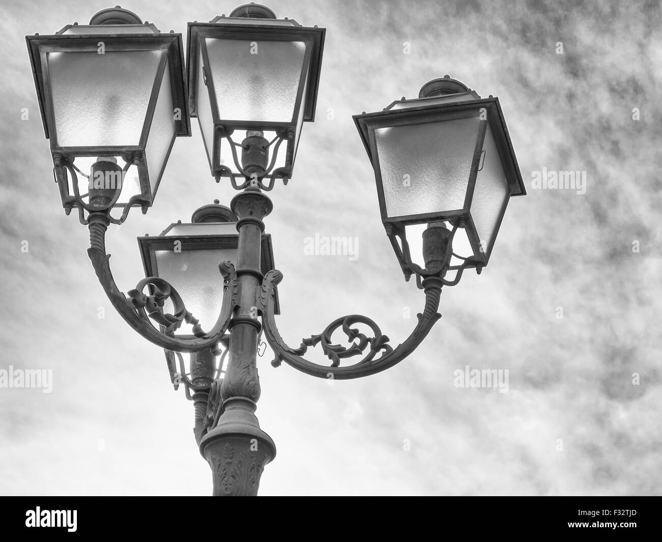 light up the sky with a bulb. Particular of a street lamp Stock Photo