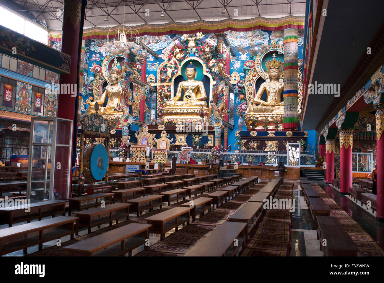 Inside the Golden temple at Namdroling Monastery Golden statues of