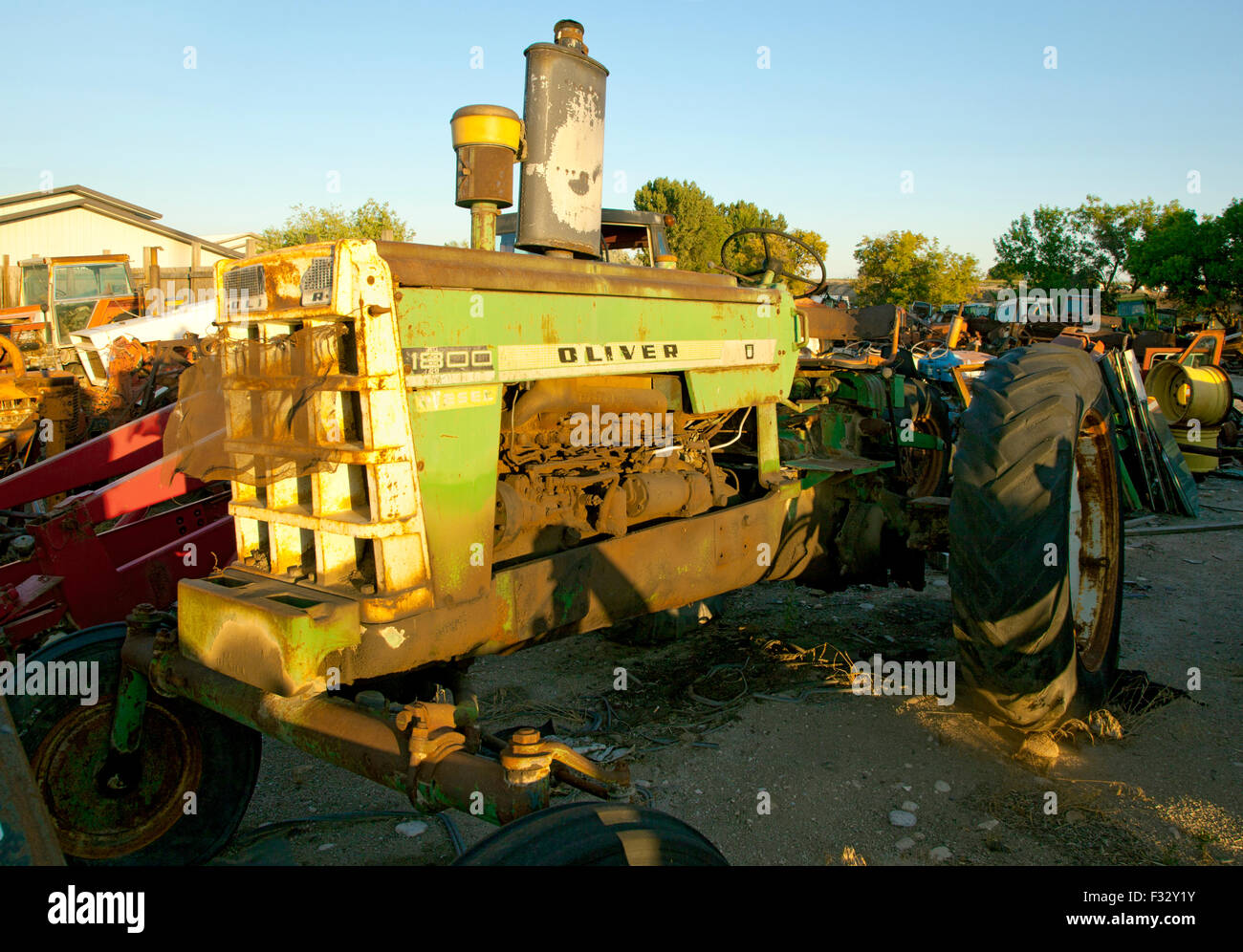 Rusted farm tractor parts in junkyard at sunset,US,2015 Stock Photo Alamy