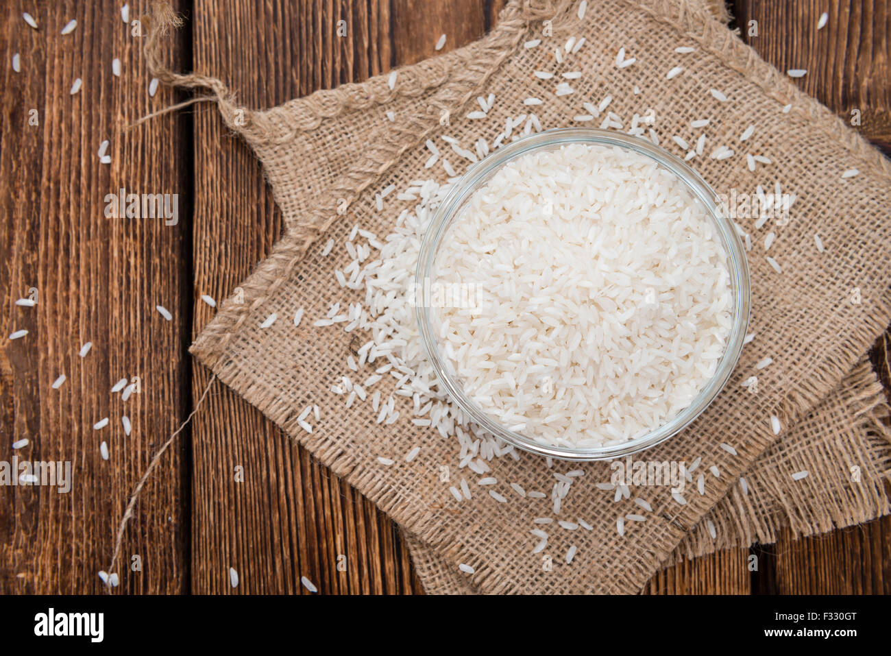 Portion of Rice (close-up shot) on rustic wooden background Stock Photo ...