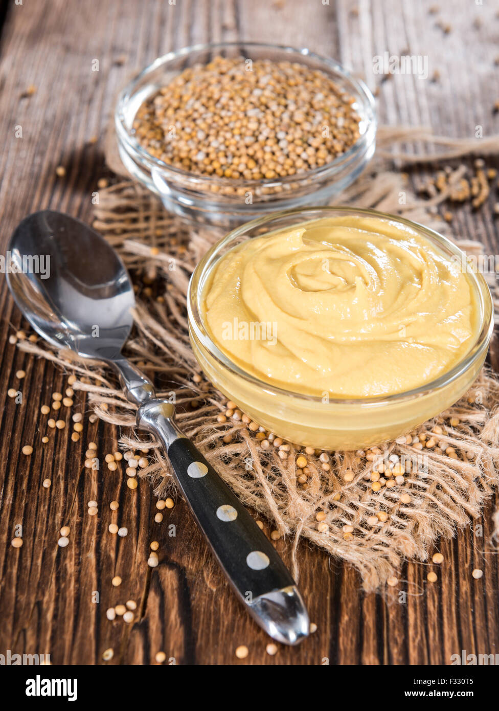 Small bowl with Mustard sauce (close-up shot) Stock Photo