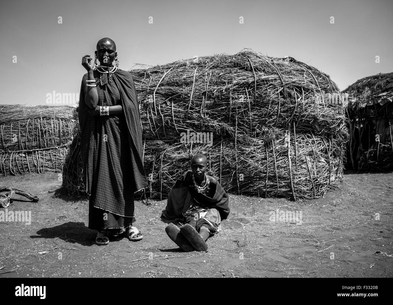 Tanzania, Arusha region, Ngorongoro Conservation Area, maasai women outside their home Stock Photo