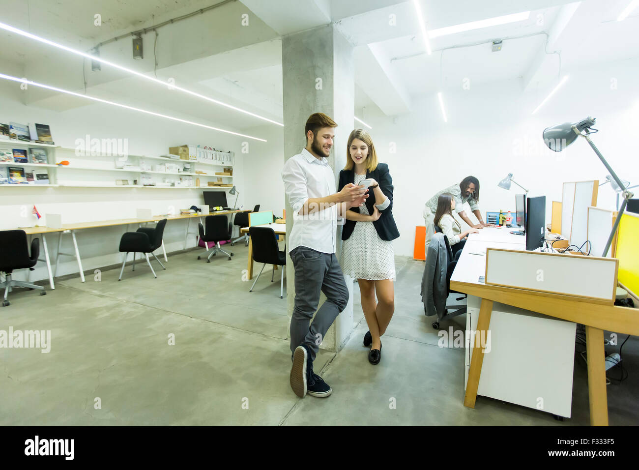 Young people in the office Stock Photo - Alamy