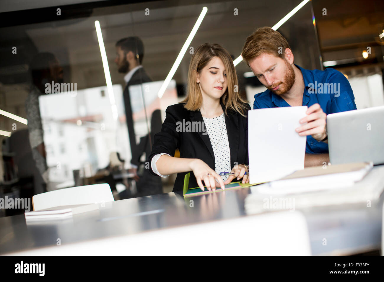 Young people in the office Stock Photo - Alamy