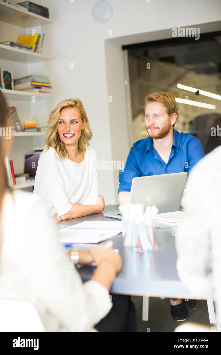 Young people in the office Stock Photo - Alamy