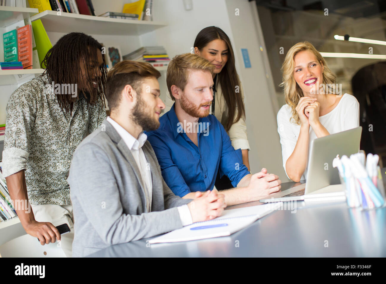 Young people in the office Stock Photo - Alamy