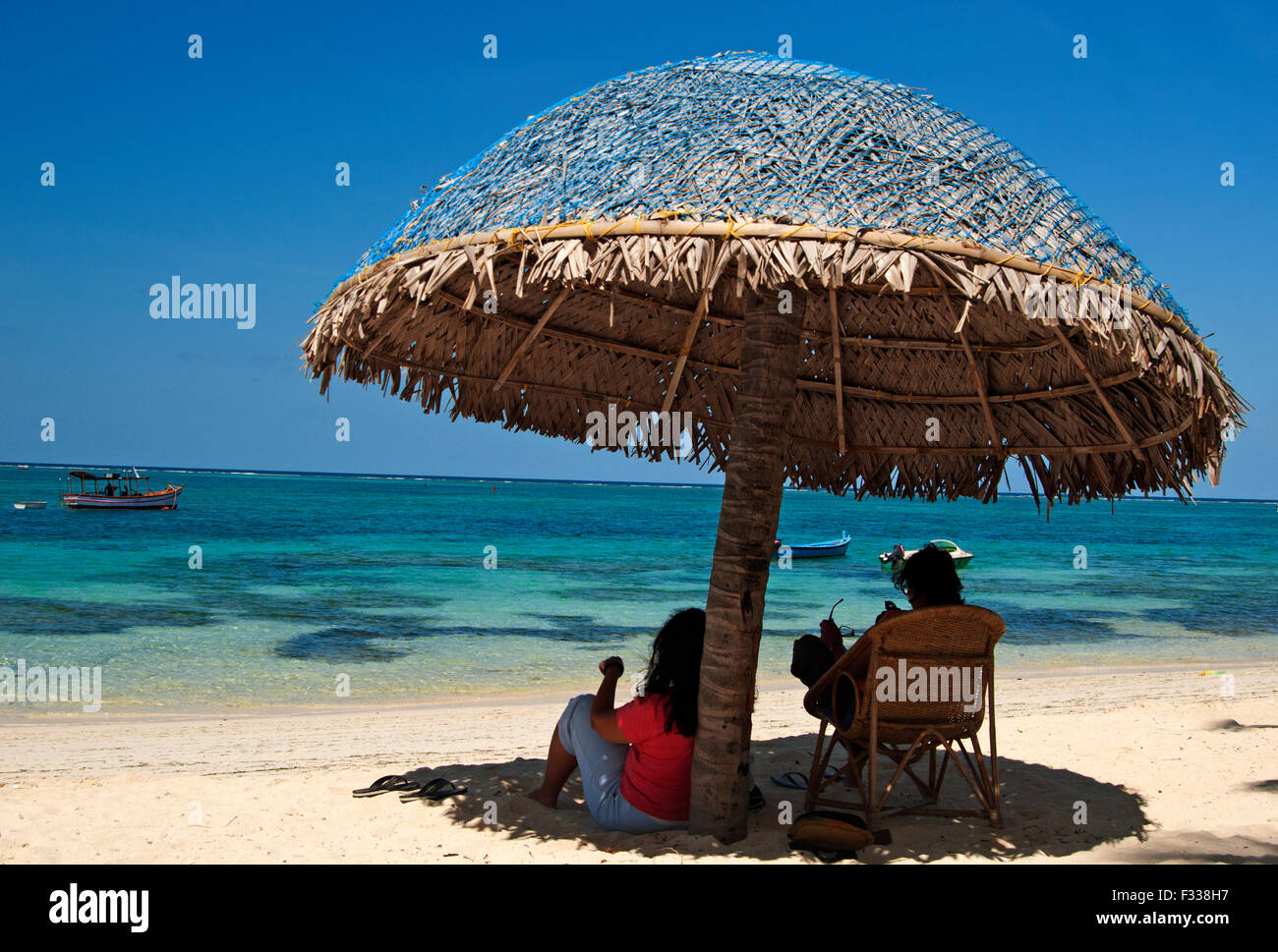 The image of tourist at beach was taken in Kavaratti island