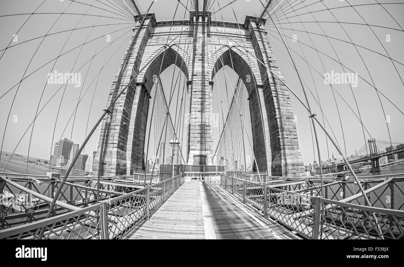 Brooklyn Bridge in fisheye lens, old film black and white style, NYC, USA. Stock Photo