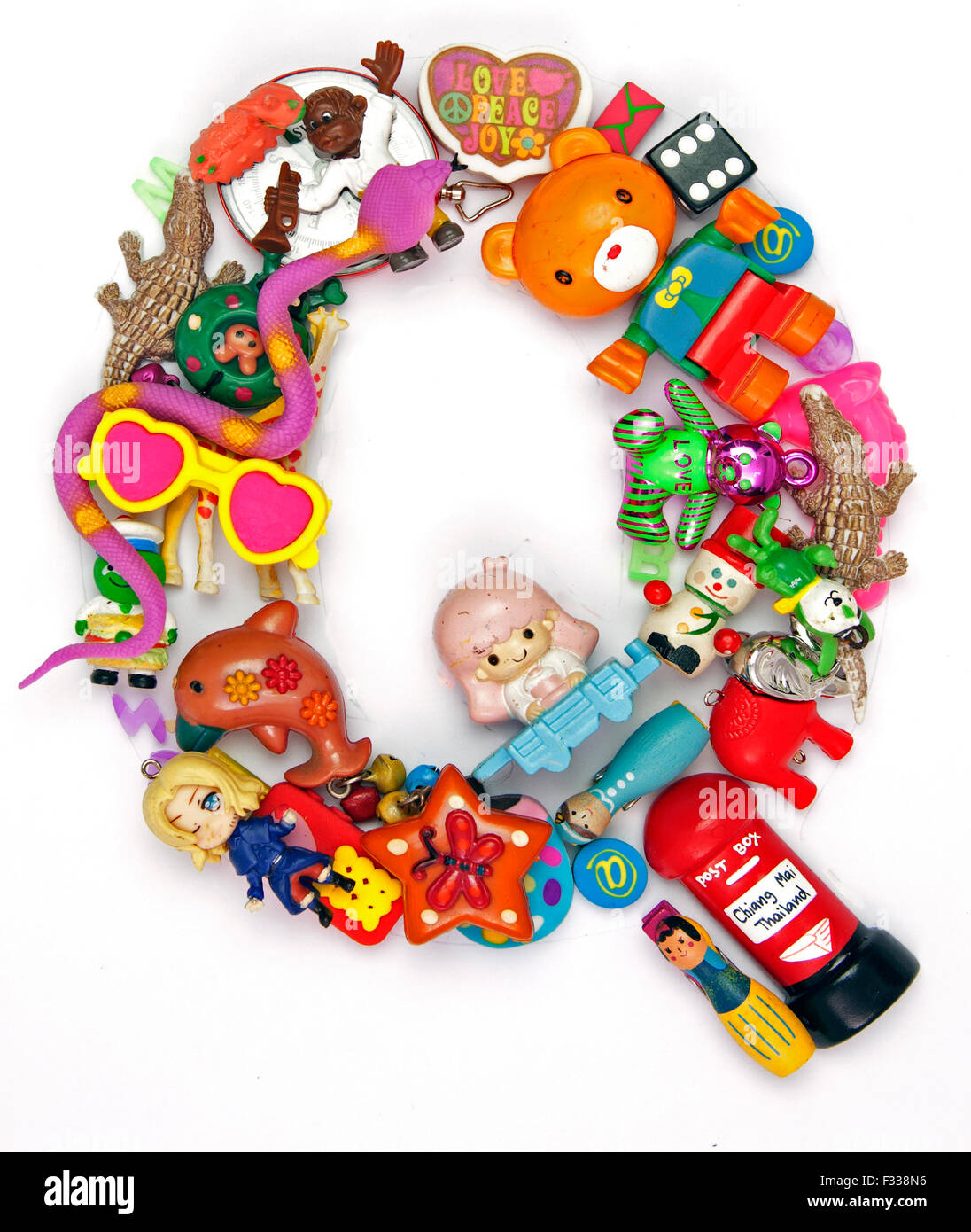 the letter Q made from small toys Stock Photo Alamy