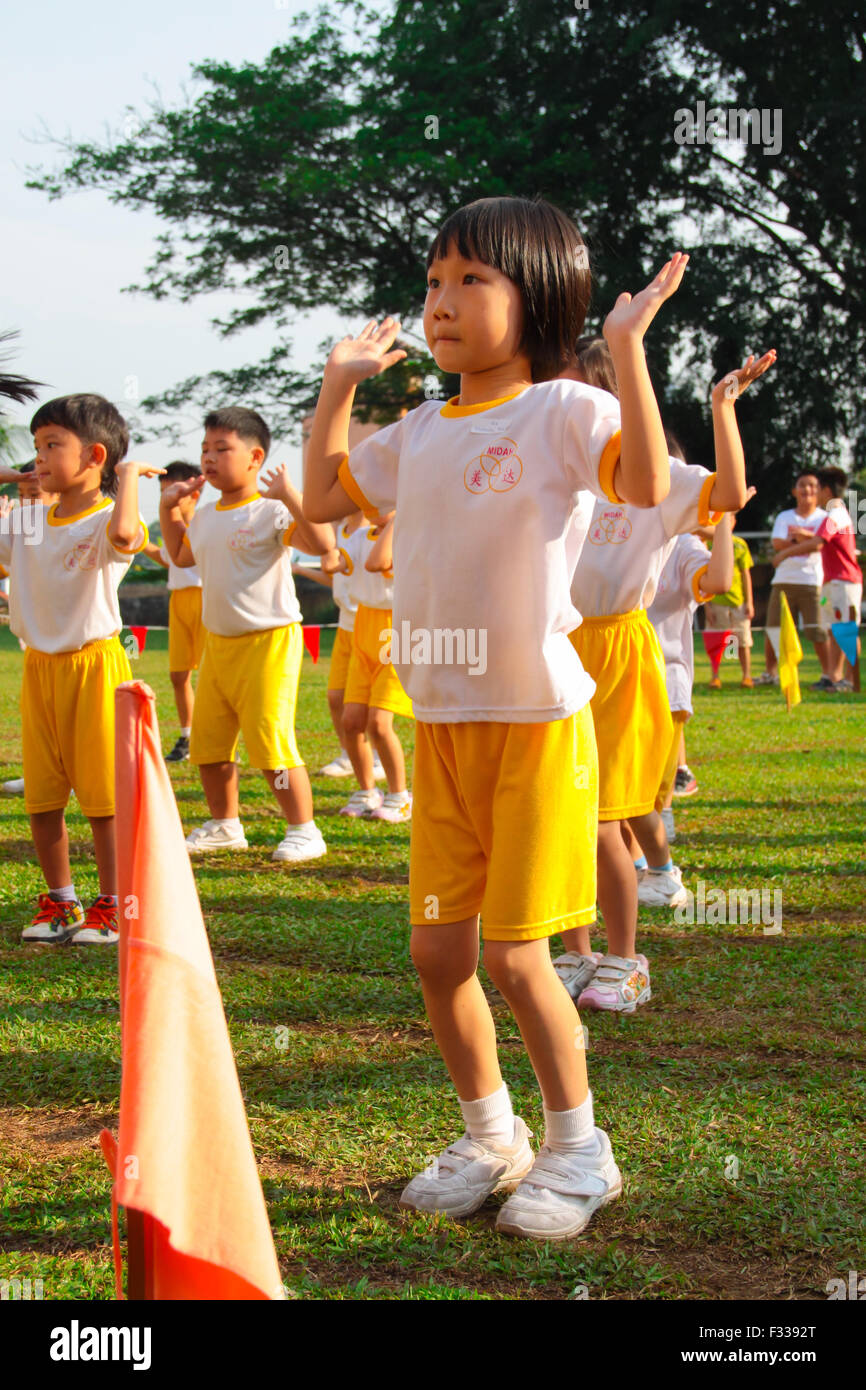  Kindergarten children performing dance at their school sport day Stock Bildidee 