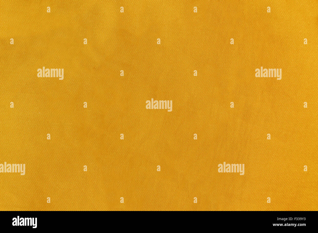 Yellow fabric background Stock Photo - Alamy