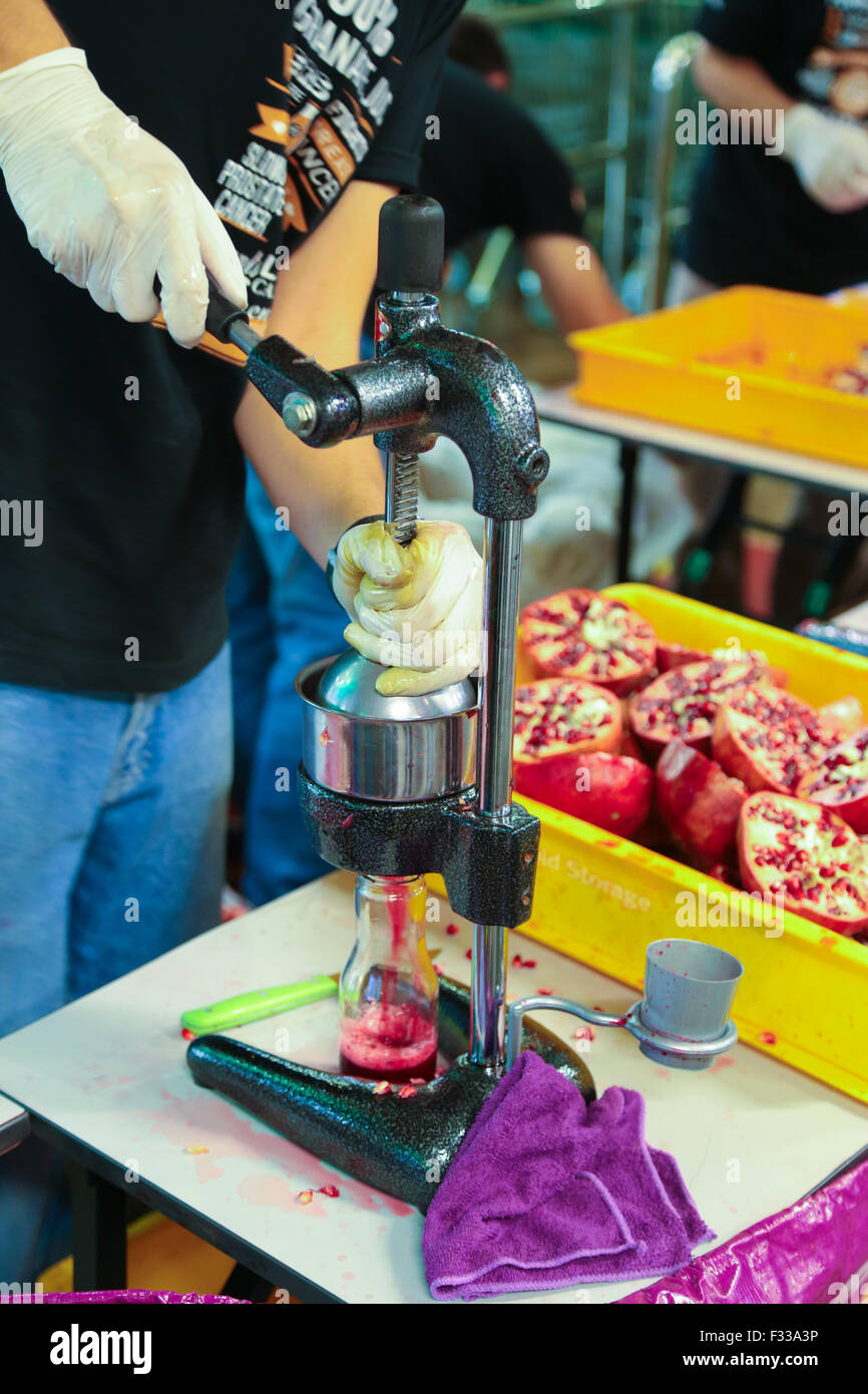 Pomegranate juice extracting Stock Photo Alamy