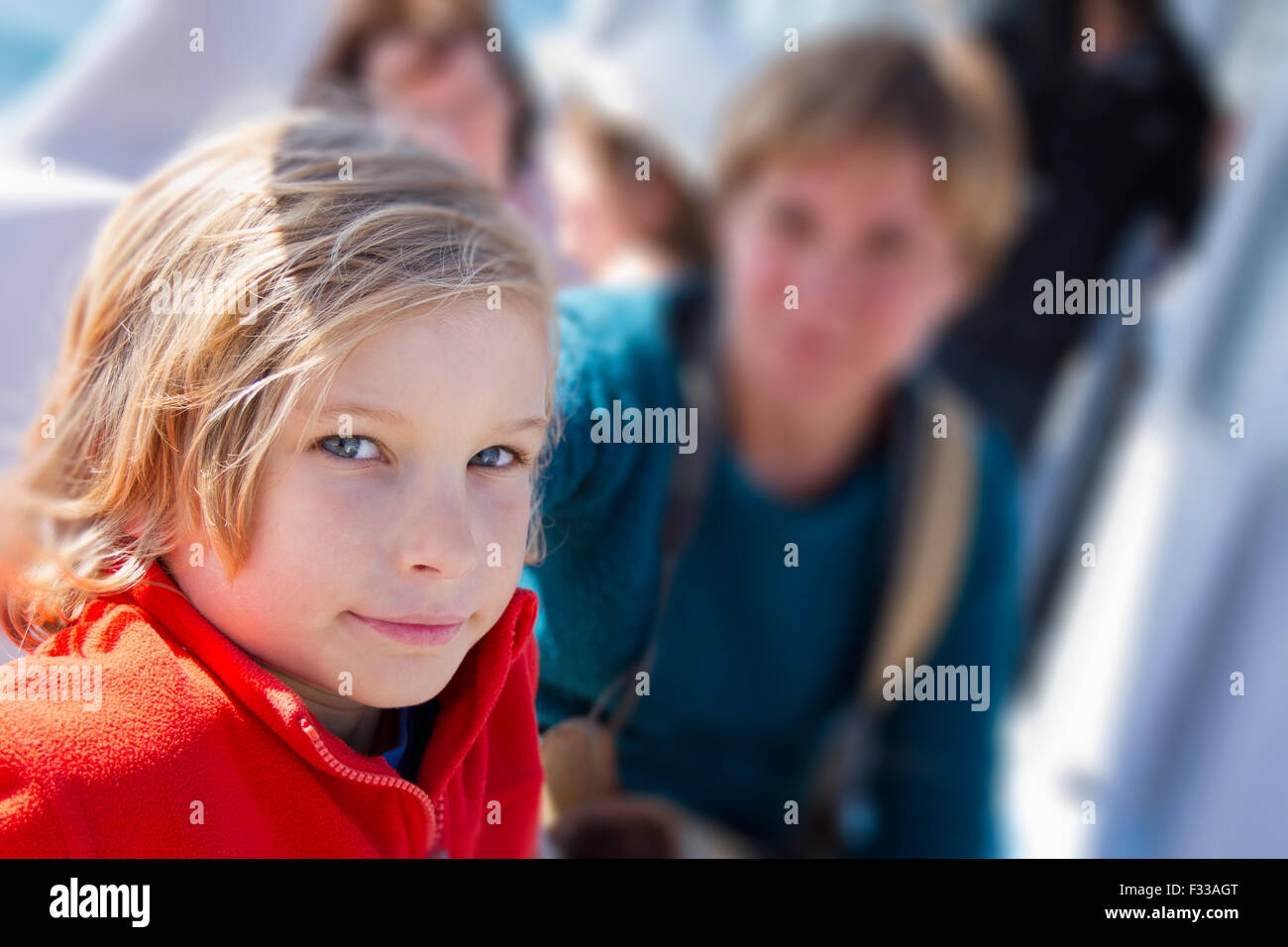 Young boy sitting on a boat. Stock Photo