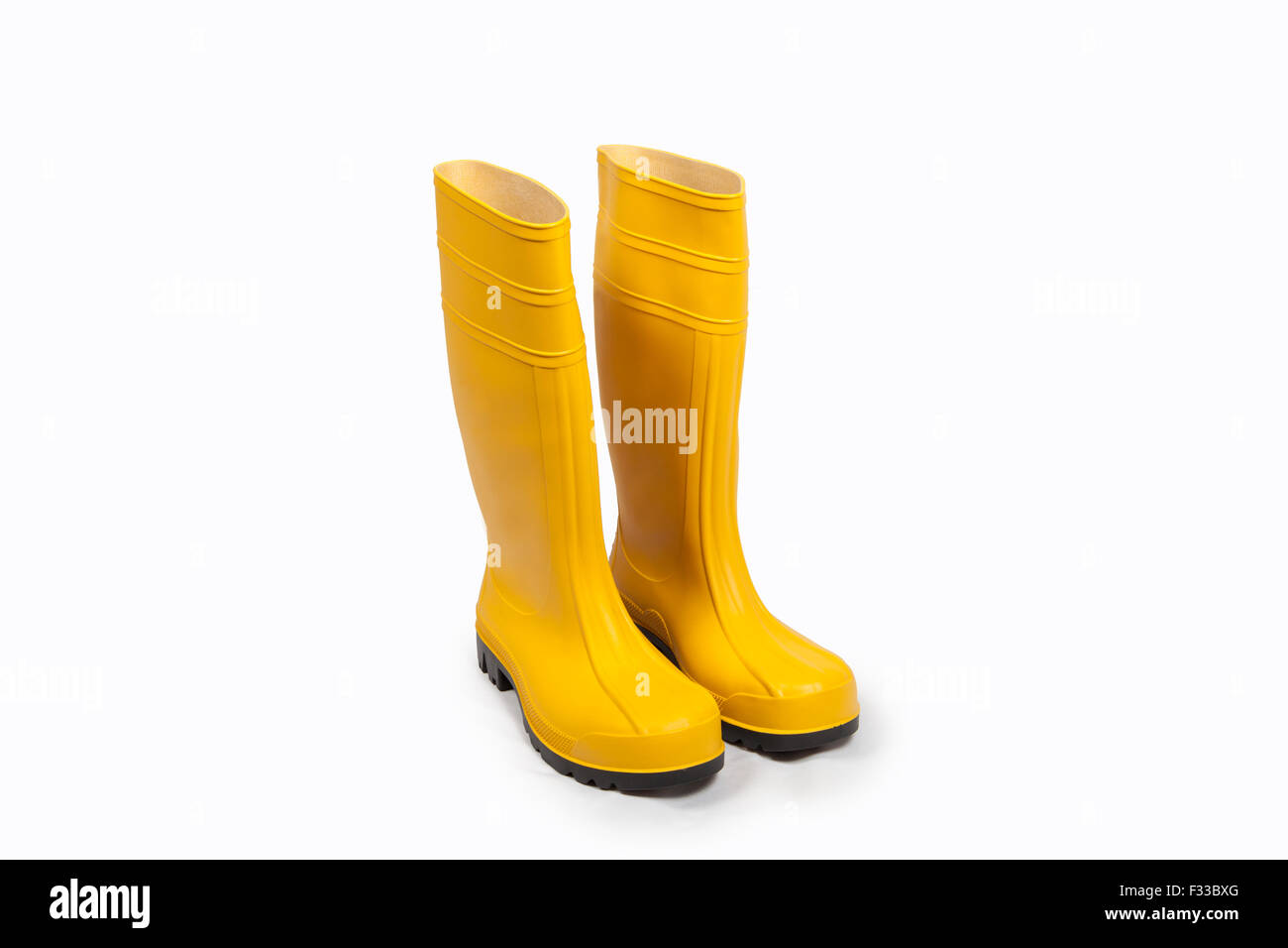 Yellow rubber boots isolated Stock Photo