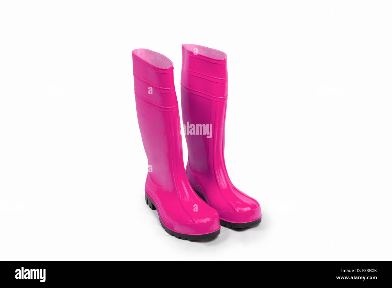 Pink rubber boots isolated Stock Photo - Alamy