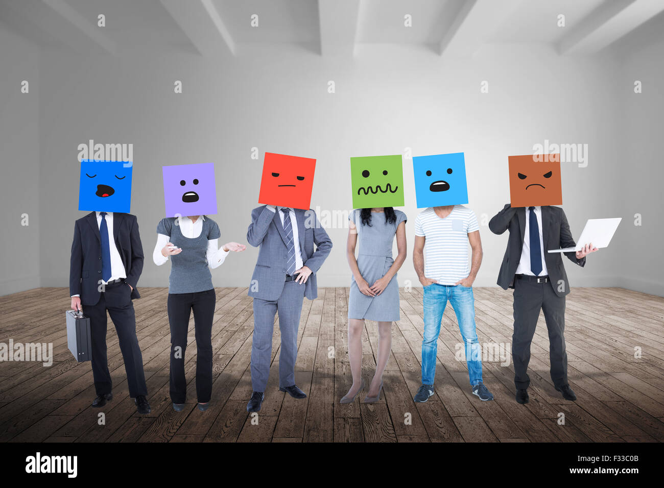 Composite image of people with boxes on their heads Stock Photo - Alamy