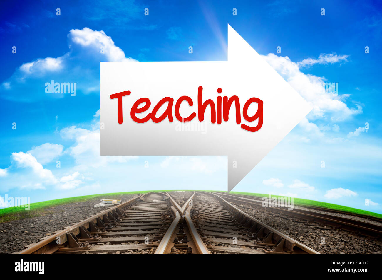 Teaching against railway leading to blue sky Stock Photo