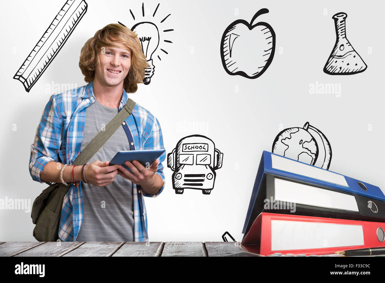 Composite image of student using tablet in library Stock Photo