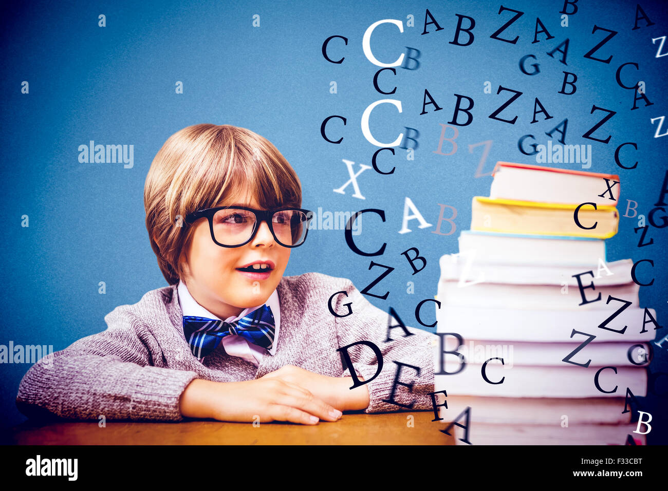 Composite image of cute pupil with pile of books Stock Photo - Alamy