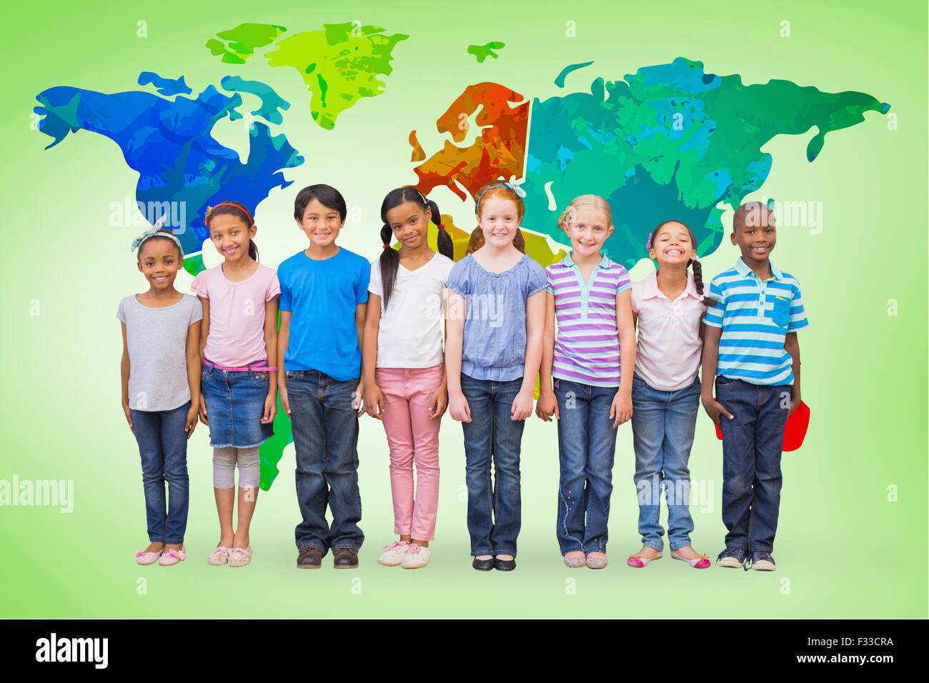Composite image of cute pupils smiling at camera in classroom Stock ...