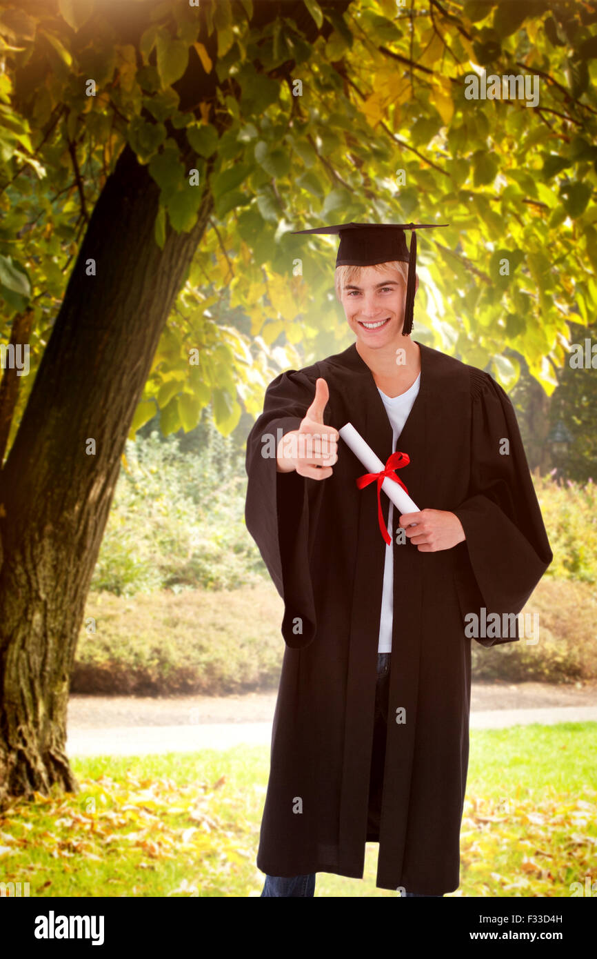 Composite image of happy teen guy celebrating graduation Stock Photo