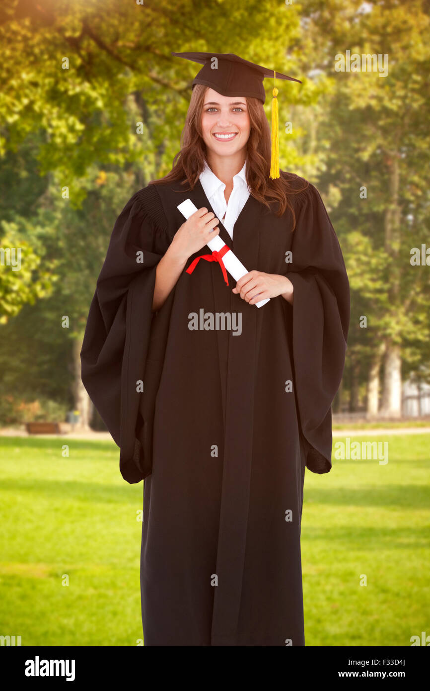 Smiling graduate woman holding degree hi-res stock photography and ...