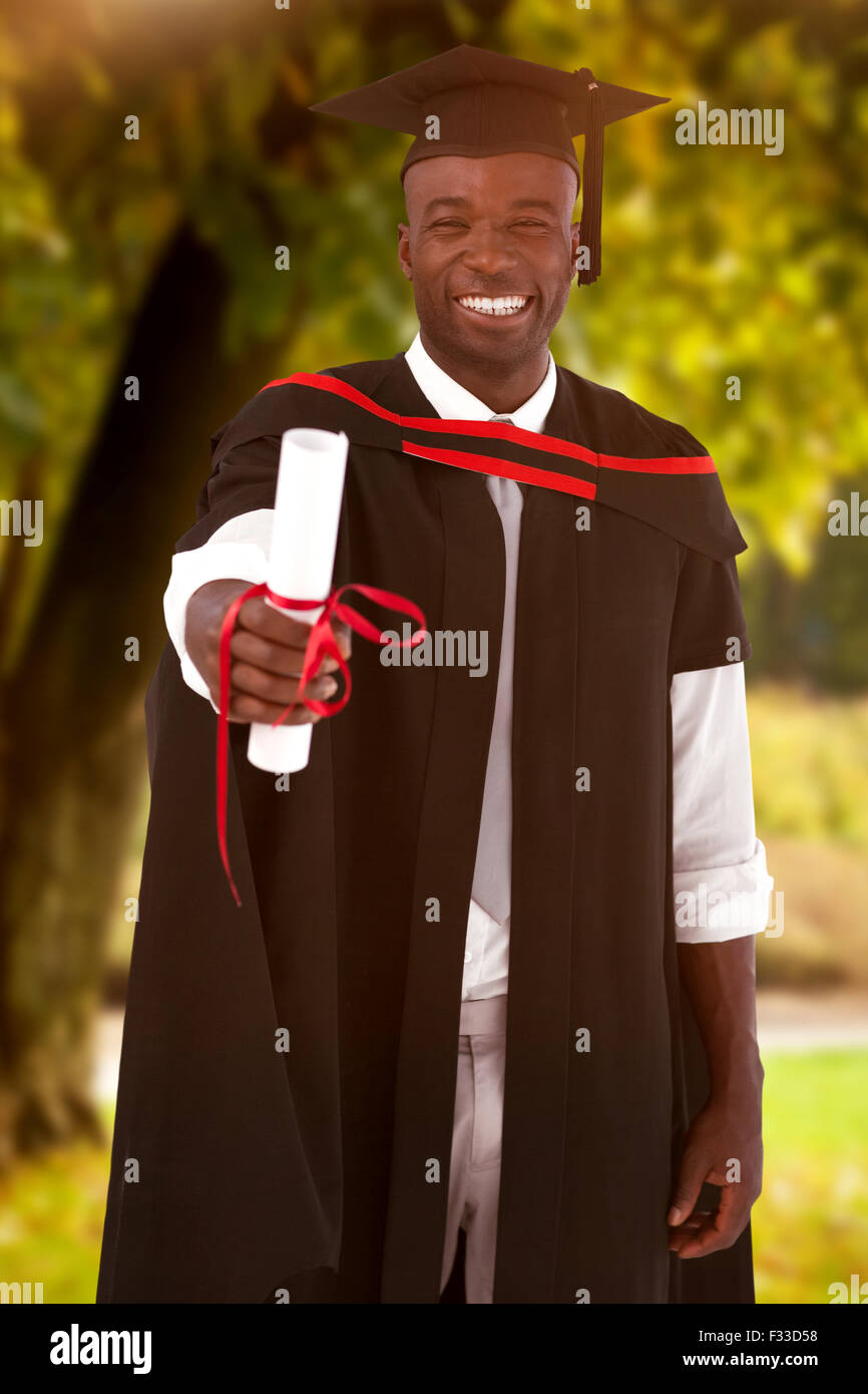 Composite image of man smilling at graduation Stock Photo