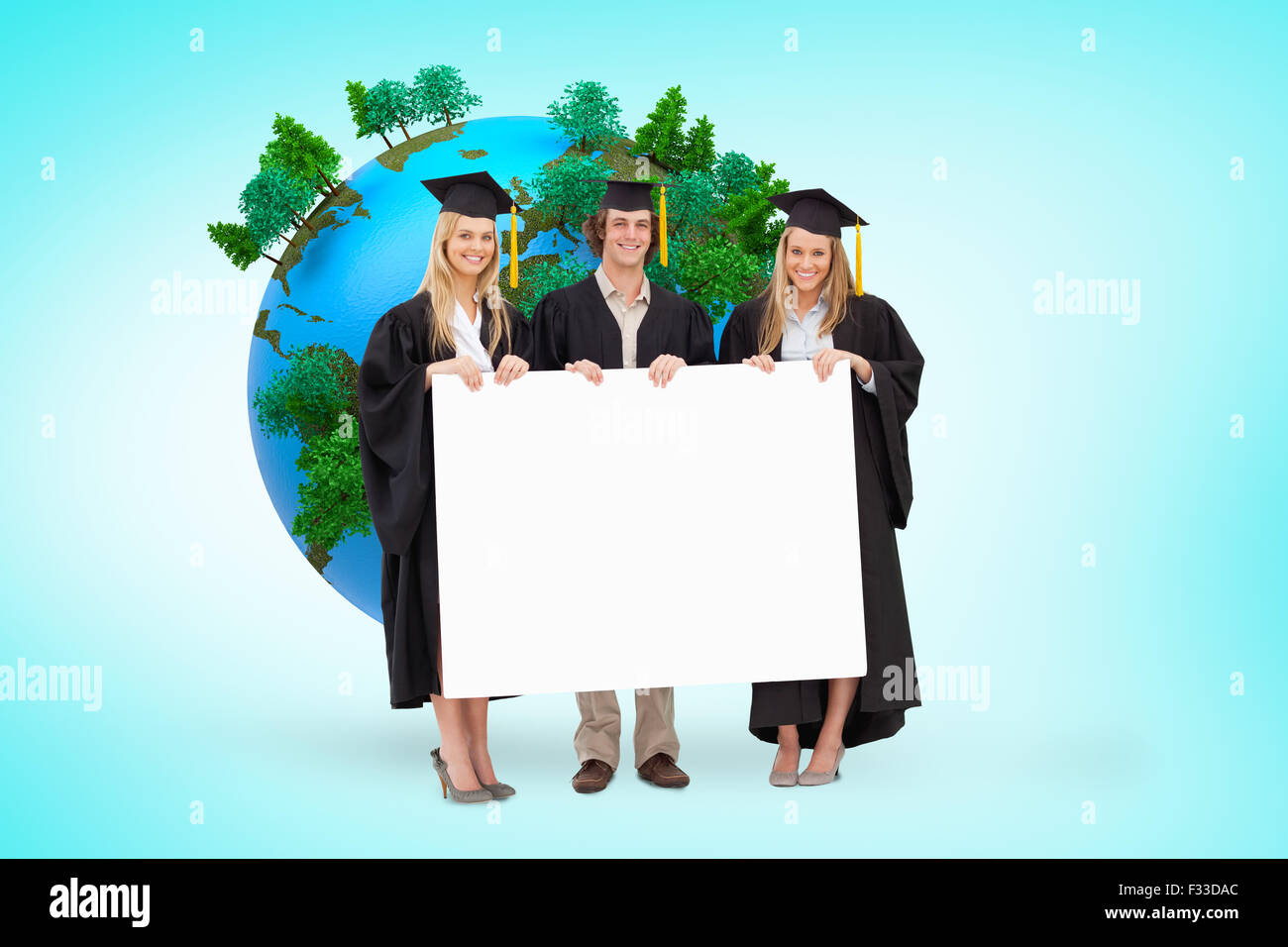 Composite image of three students in graduate robe holding a blank sign Stock Photo