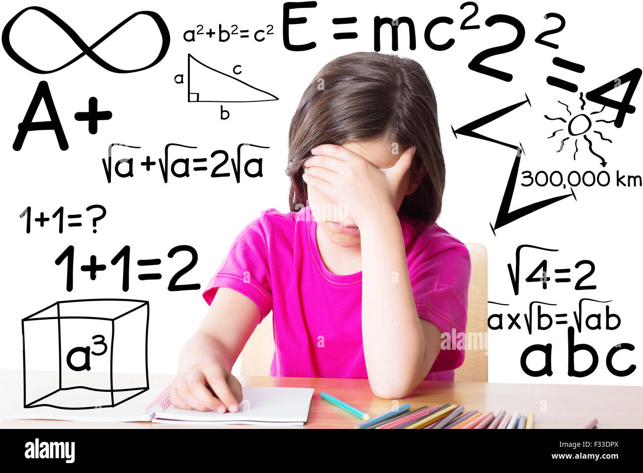 Composite image of cute pupil working at her desk Stock Photo - Alamy