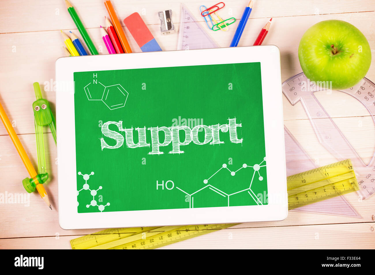 Support against students desk with tablet pc Stock Photo