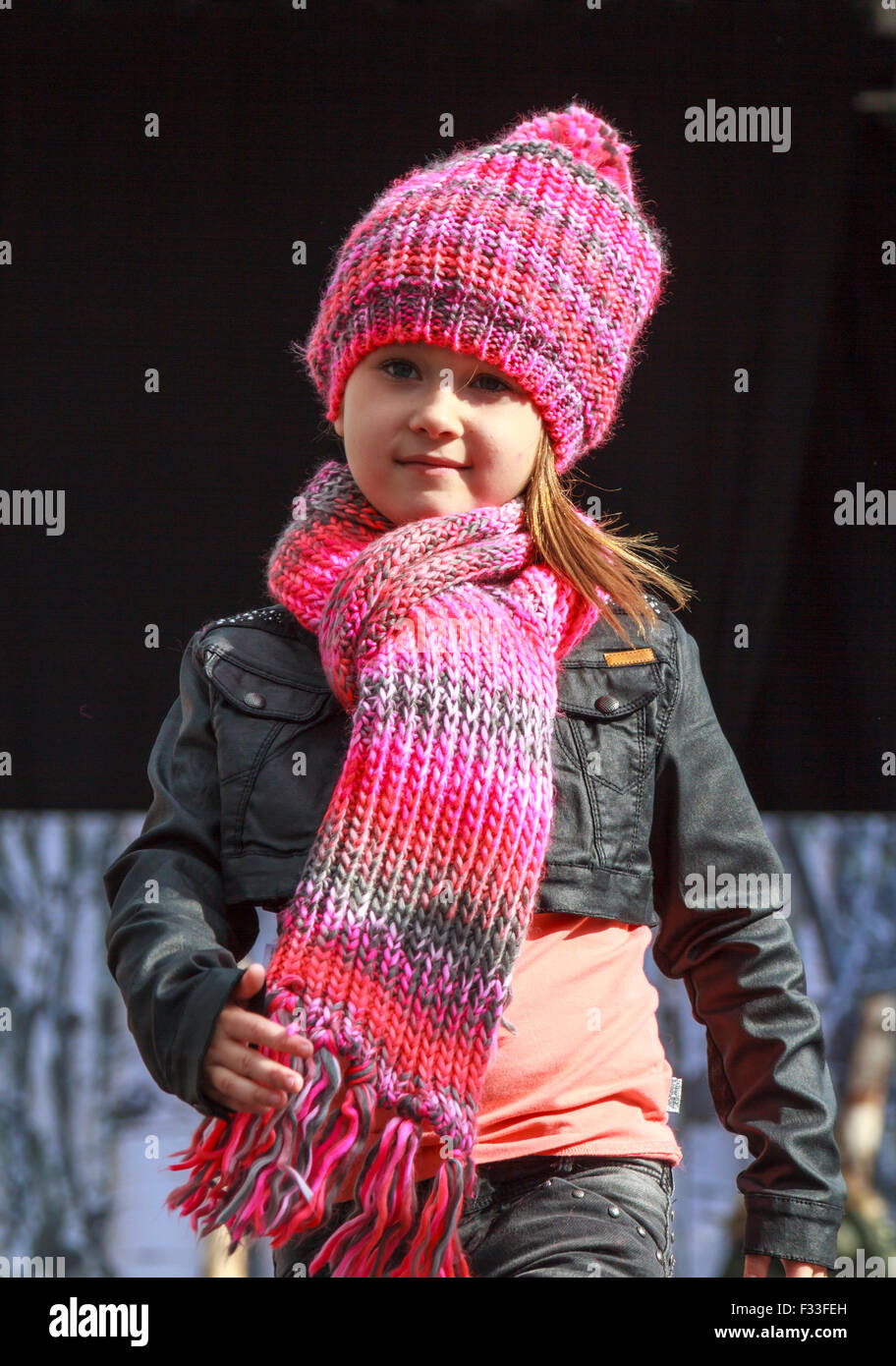 Dordrecht, Netherlands. 27th September, 2015. Free fashion show in the main square organized by the municipality. Child model dressed in pink on the catwalk showcasing the new autumn collection. Credit:  Tony Taylor/Alamy Live News Stock Photo